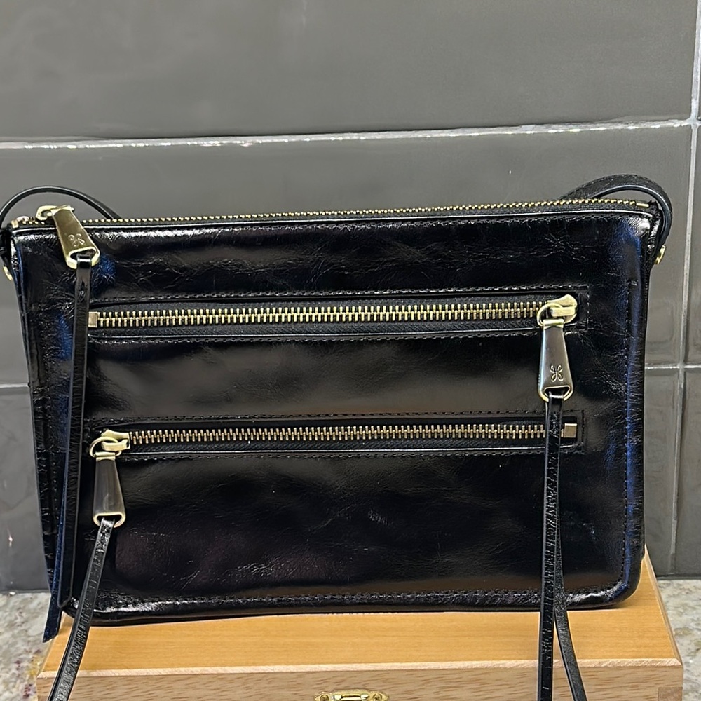 HOBO LEATHER CROSSBODY Sleek Black Crossbody Bag with Gold Zippers